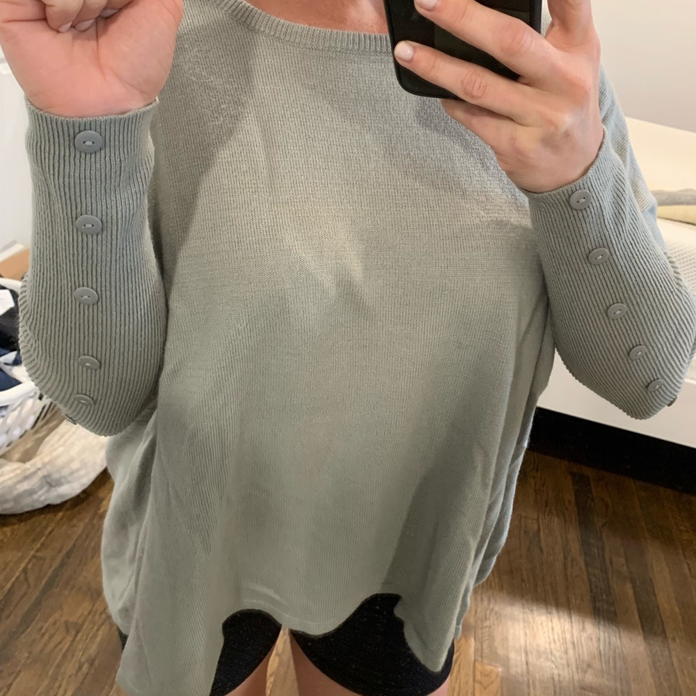 Grey sweater with buttons on sleeve